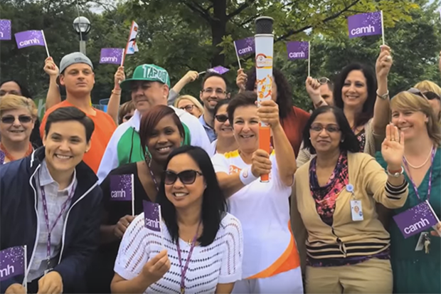 Dr. Catherine Zahn, official Pan Am torchbearer #41, brings the Pan Am torch to CAMH.