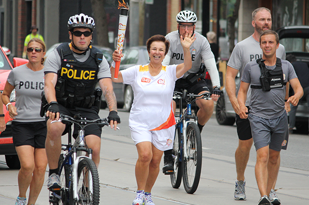 Dr. Catherine Zahn, official Pan Am torchbearer #41, brings the Pan Am torch to CAMH.