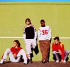 Teenage guys sitting by track 