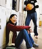 Teens talking by lockers 