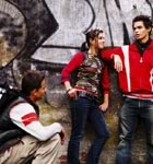 Teens standing by graffiti wall talking