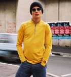 Teenage guy standing by roadway 