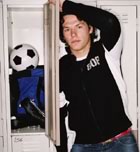 Teenage guy by locker