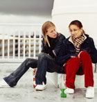 Teenage girls on roof stormy weather