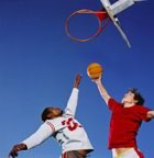 Basketball players under hoop 