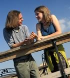 Teen couple outside talking 