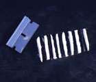 Lines of cocaine beside a razorblade
