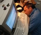 Guy asleep at the computer