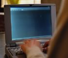 Laptop screen with 2 hands