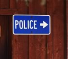 Police station road sign