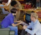 Students in cafe with laptop