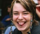 Young woman pierced and grinning