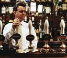 Bartender behind beer taps