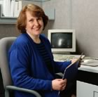 Woman sitting at computer smiling