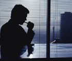 Man at window at dawn/dusk
