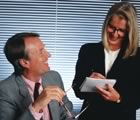 Man and woman talking at office