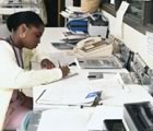 Nurse working on records at station