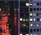 Office building at night traffic beside