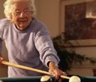 Older woman playing pool