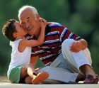 Boy hugging grandfather
