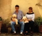 Couple sitting outside with dogs