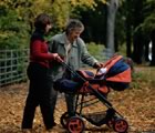 Mother grandmother stroller in the fall