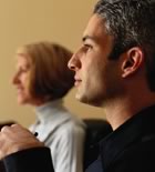 Man and woman listening to presentation