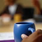 Meeting coffee cup foreground