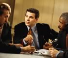 Meeting with three men in suits