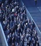 Crowd moving across bridge