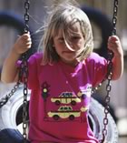 Girl on tire swing