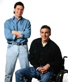 Gay couple, one in wheelchair