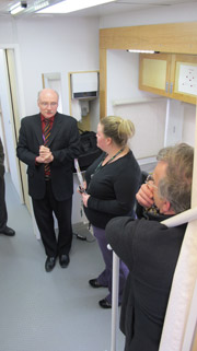Dr. Jim Kennedy talks to people inside mobile lab