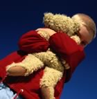 Boy hugging teddybear