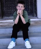Boy sitting on steps