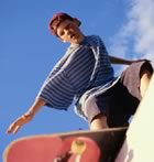 Boy skateboarding on ledge