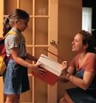 Daughter getting lunchbox for school