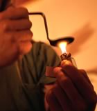 Heating a spoon with flame