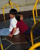 Kids riding roundabout