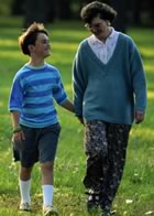 Mother and daughter walking in park