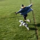 Running in a field with a dog